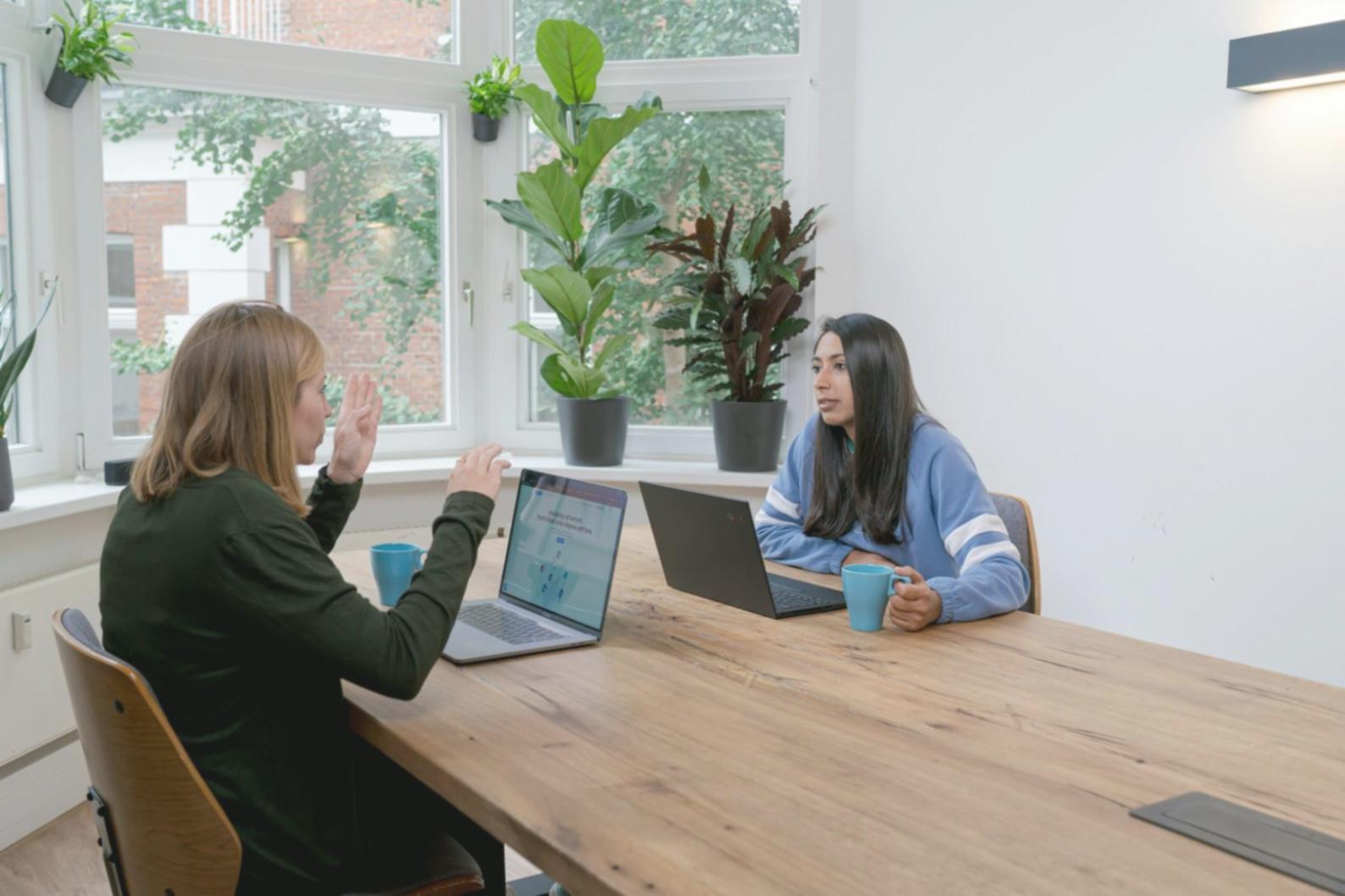 UAT coordination team meeting with stakeholders reviewing test scenarios