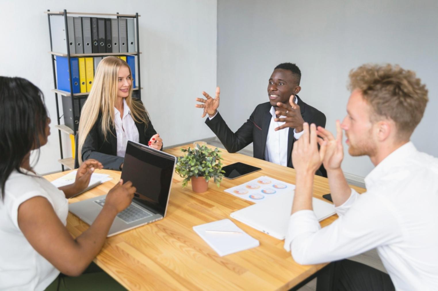 Software development team reviewing UAT results and analytics